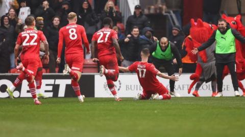 Leyton Orient midfielder Jamie Donley celebrates after his magnificent shot saw his side open the scoring in their FA Cup tie with Manchester City at Brisbane Road