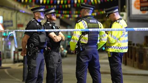 Police officers at the scene in Hailsham