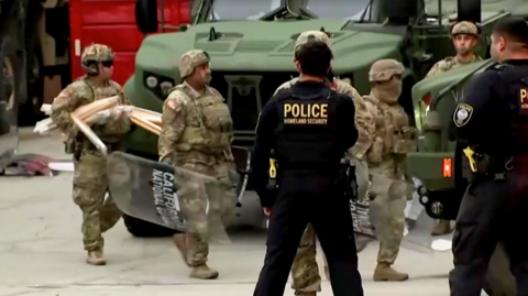 National Guards stood next to tanks in LA.
