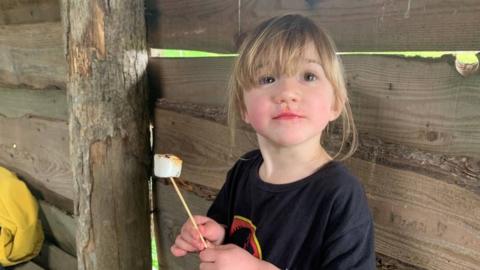 Tabitha holding a toasted marshmallow