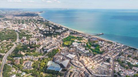 View over Bournemouth beach, pier, city and Dorset coastline on a sunny day