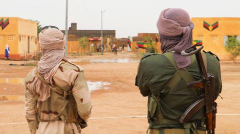 Fighters for The National Movement for the Liberation of Azawad (MNLA) stand guard during the Congress for the Fusion of Movements in Kidal on August 28, 2022