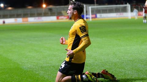 Aaron Wildig of Newport County celebrates scoring a goal