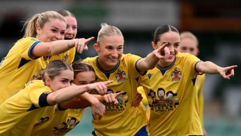 Barry Town United players celebrate a goal during their 3-0 win over Cascade YC