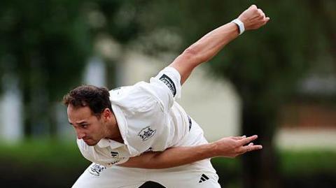 Gloucestershire bowler Zaman Akhter in action