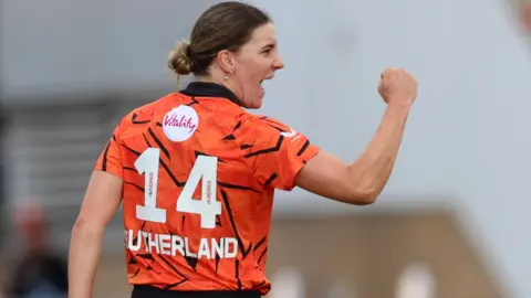 Annabel Sutherland celebrates