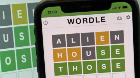 This images shows the screen of an IPhone, showing the screen of the online game, Wordle.