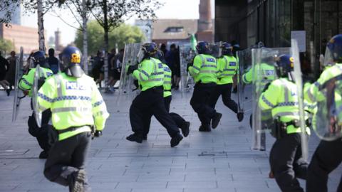 Police charge at protestors in Liverpool city centre