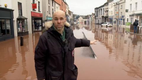 Will Vernon standing in floodwater in Monmouth