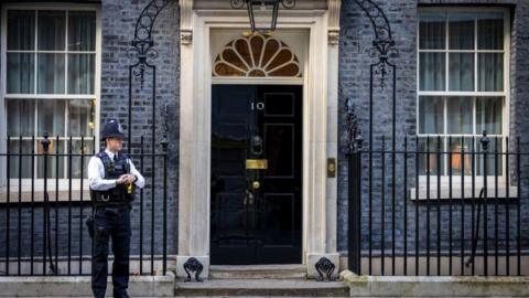 Police officer stands outside 10 Downing Street