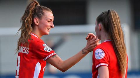Caitlin McGuinness is congratulated after scoring Cliftonville's first goal against Glentoran