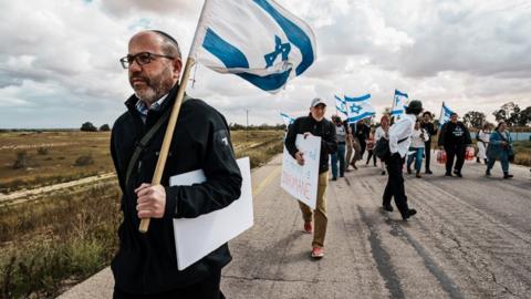 Protesters try to block border crossings to prevent aid crossing into Gaza