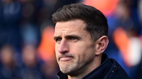 A concerned looking Portsmouth boss John Mousinho