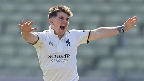 Ethan Bamber throws his arms out as he appeals to the umpire during a game