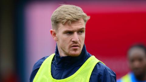 Jack Sparkes during a pre-match warm-up