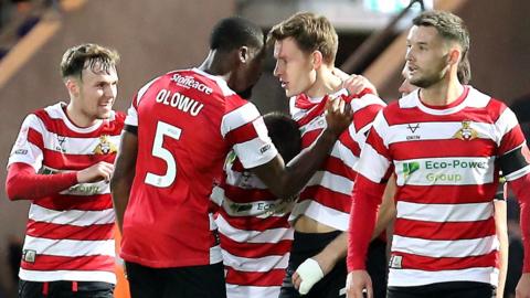 Doncaster players celebrate Joe Ironside's equaliser against Notts County