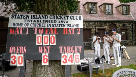 Players prepare prior to a cricket match at the Staten Island cricket club in Staten Island on June 11, 2022. 