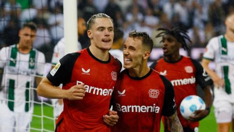 Florian Wirtz and Alex Grimaldo celebrate