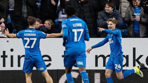Jimmy-Jay Morgan celebrates giving Peterborough the lead against Bolton