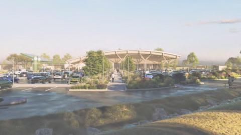 An AI illustration of the proposed M4 service station showing a large car park, a building and trees/ greenery 