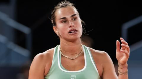 Aryna Sabalenka watches on during the Madrid Open