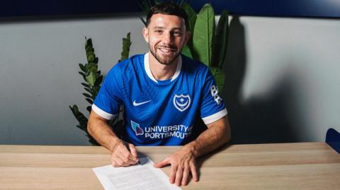 Conor Chaplin poses for a photo after sealing his return to Portsmouth on loan