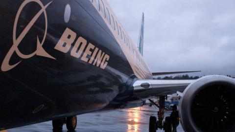 A Boeing 737 Max plane sits outside the hangar in Renton, Washington, USA