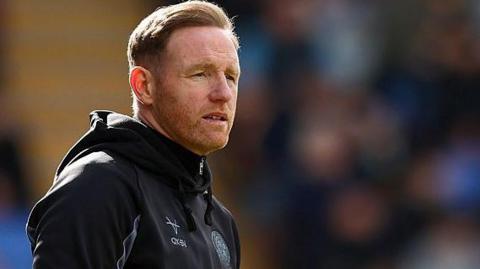Gavin Cowan looks on from the touchline during a Shrewsbury Town