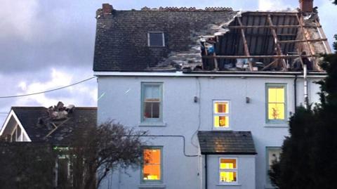 A house in Cornwall with its roof part blown off