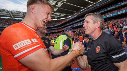 Rian O'Neill with Kieran McGeeney after Armagh's All-Ireland Final win over Galway last July