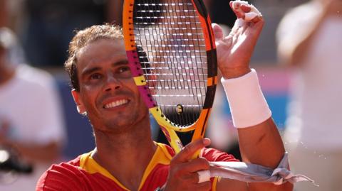 Rafael Nadal waves to the crowd at Roland Garros during the Paris Olympics