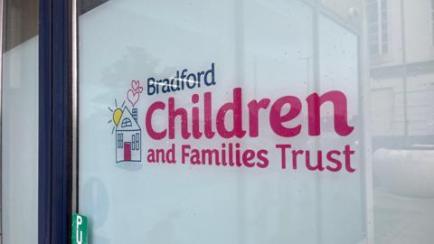 Bradford Children and Families Trust sign on its building window