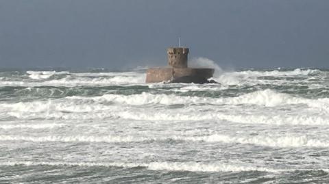 Fierce waves batter the beach at St Ouen.