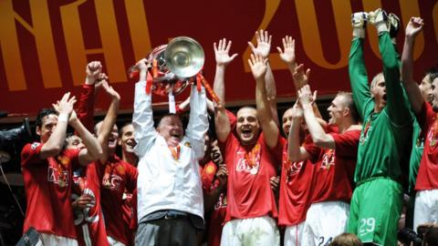 Sir Alex Ferguson lifting the Champions League trophy