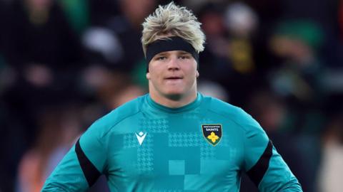 Henry Pollock warms up