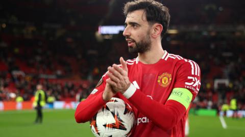 Bruno Fernandes with the matchball after scoring a hat-trick for Manchester United to help them beat Real Sociedad in the Europa League