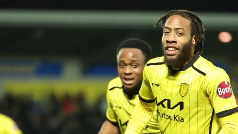 Burton's Rumarn Burrell celebrates his goal against Reading