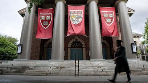 Harvard University prepares for graduation, with banners hanging from buildings