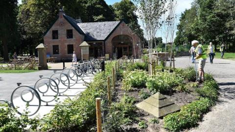 Bike racks, bushes, borders and pavements in the park
