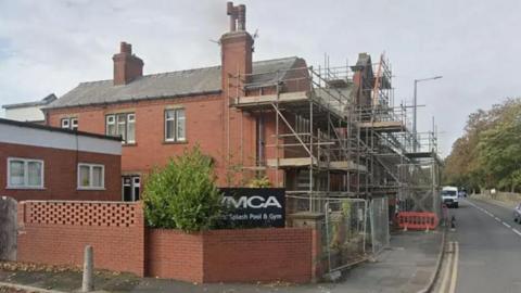 External view of the Kirkham Baths building which suffered storm damage in 2021. There is scaffolding at the front of the building.