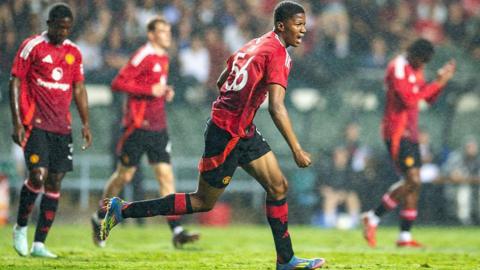 Chido Obi celebrates scoring for Manchester United against Hong Kong
