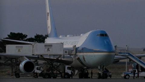 A catering truck parked alongside the old Air Force One jet prior to departure from Ankara 