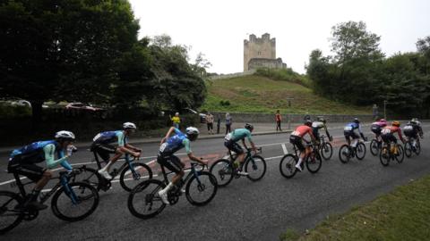 Cyclists pass by Conisbrough Castle on Stage Three of the Tour of Britain 