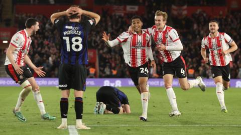 Shea Charles celebrates his goal for Southampton in extra time as Boro players have their heads in their hands