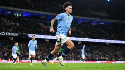 Nico O'Reilly celebrates scoring a goal for Manchester City against Plymouth Argyle