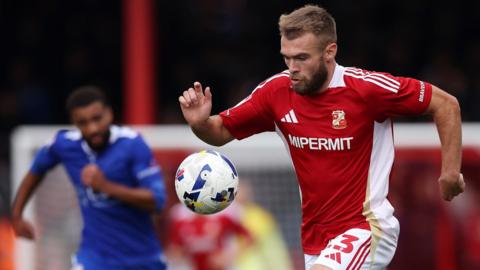 Aaron Drinan playing for Swindon
