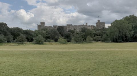 A general view picture of fields in Home Park, which has Windsor Castle in the background.
