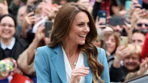 Catherine waving to cheering crowds at Reggio Emilia