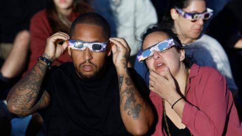 Couple watching eclipse