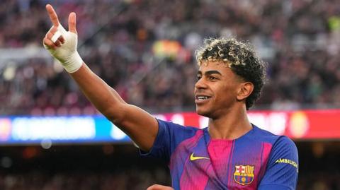 Lamine Yamal celebrates completing his hat-trick during Barcelona's win over Villarreal
